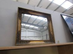 A gilt framed mirror,.