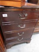 a wooden 2 drawer filing cabinet.