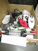 A box of kitchen utensils.
