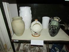 4 vases and a salt pot.