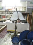 A table lamp with shade.