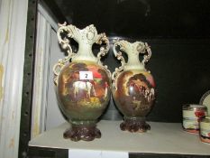 A pair of Staffordshire vases depicting horse scenes.