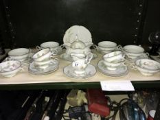 A shelf of German porcelain table ware.