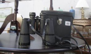 A cased pair of Zenith binoculars.