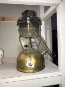 An old Tilley lamp with spares.