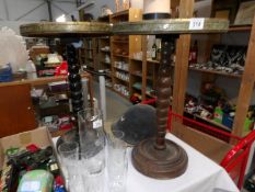 A pair of brass topped tables