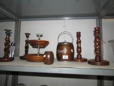 A biscuit barrel, 2 pairs of wooden candlesticks, wooden stand etc.