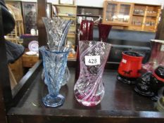 5 coloured glass vases.