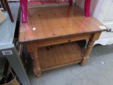 A glass topped coffee table,.