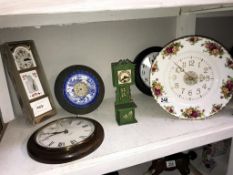 A quantity of clocks including Royal Albert Old Country Roses, blue willow etc.