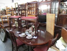 An extending dining table and 6 chairs.