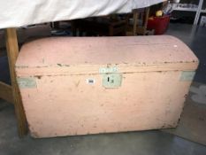 A shabby chic wooden trunk.