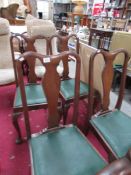 A set of 4 high back dining chairs.