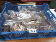 A large quantity of new gilt metal cutlery.