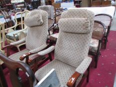 A pair of arm chairs.