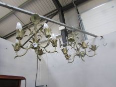 A pair of 4 branch ceiling lights.