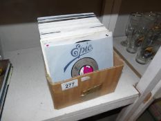 A box of 45 rpm records.