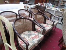 A set of 6 conservatory chairs with cushions,