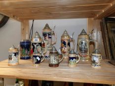 A collection of 10 beer steins, some a/f,