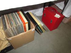 A box and a case of LP records together with a selection of 78 rpm records.