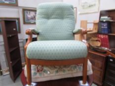 A wood framed arm chair,.