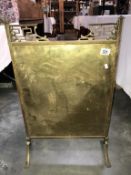 A brass fire screen.