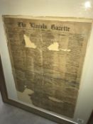 A framed and glazed distressed front page of 'The Lincoln Gazette'.