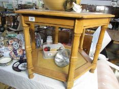 An octagonal coffee table with glass top.