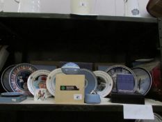 A shelf of collector's plates, Wedgwood Jasper ware etc.