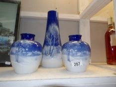 A pair of vases and a taller matching example.