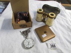 A Theakston pocket watch, a pair of opera glasses and a powder compact.