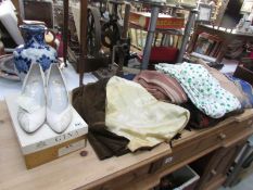 A pair of vintage shoes and a quantity of vintage clothing.