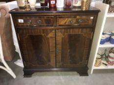 A mahogany effect cabinet.