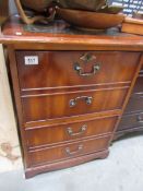 A wooden 2 drawer filing cabinet.