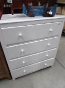 A painted 4 drawer chest.