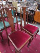 A pair of high back dining chairs,