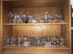 2 shelves of drinking glasses.