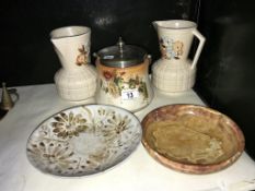 A biscuit barrel, 2 jugs and 2 bowls.