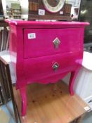 A pink 2 drawer chest.