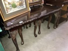 A coffee table with nesting tables underneath,