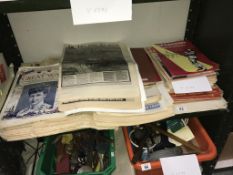 A shelf of old newspapers and magazines.