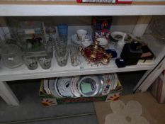A shelf and a box of commemorative china, plates etc.