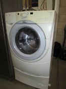 A large Whirlpool washing machine.