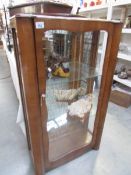 An old china cabinet (missing one side glass panel).