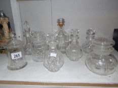 A mixed lot of cut glass perfume bottles, liquer decanters, jars etc.