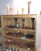 4 shelves of carnival glass vases and dishes (19 pieces).