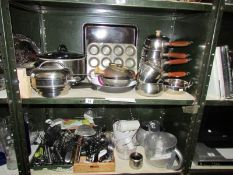 2 shelves of kitchen ware.