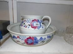 A pottery Adderleys hand painted jug and basin set.