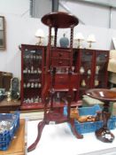 A mahogany wig stand,