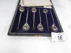 A cased set of 'bead' and 'shell' spoons.